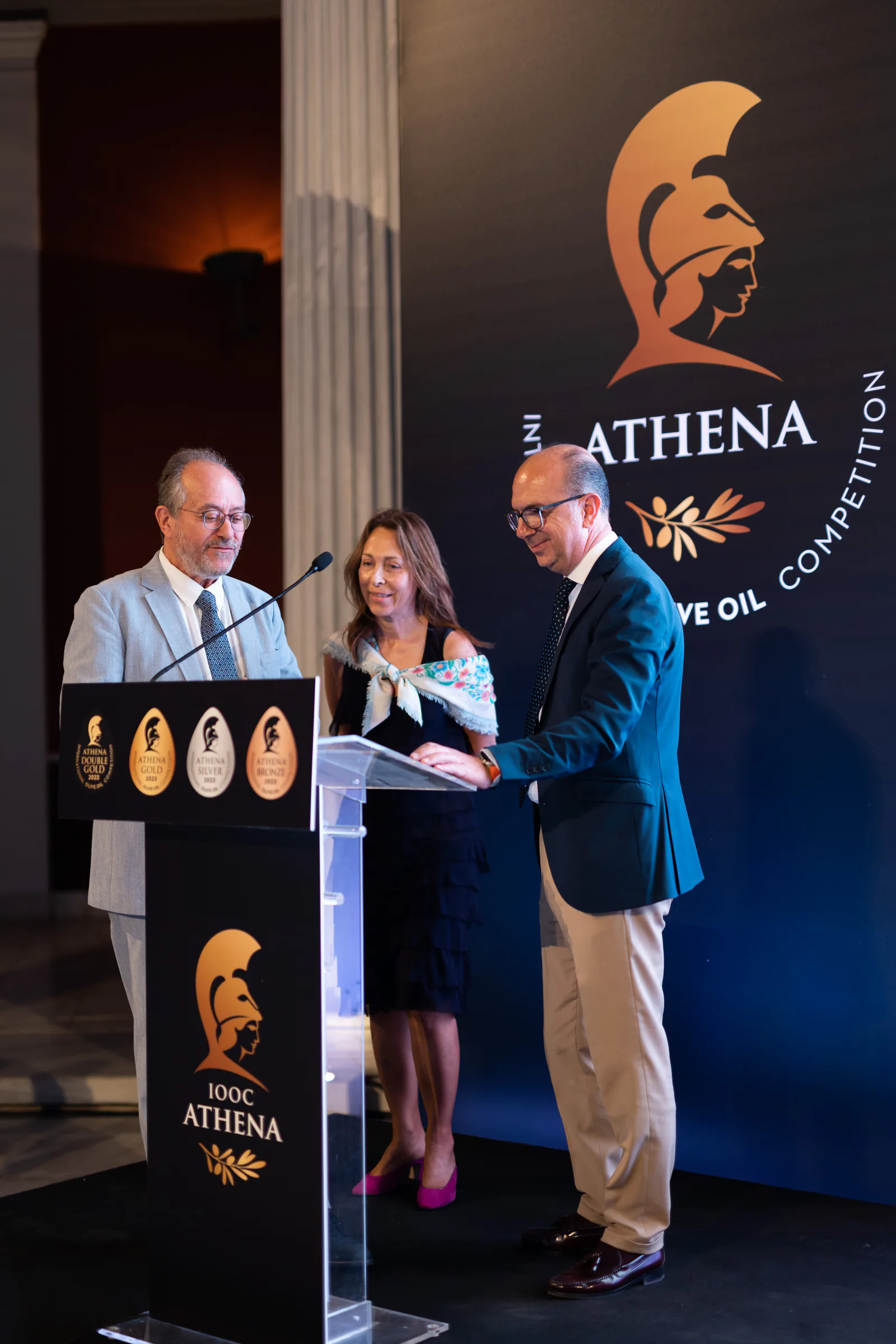 An award is presented to Martín de Prado at the ATHENA International Olive Oil Competition